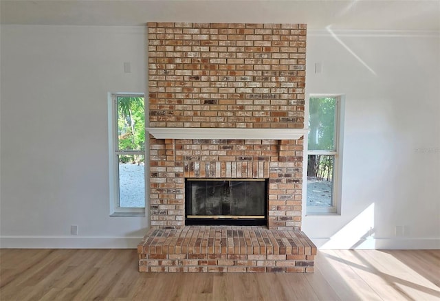 4074 Redbird Cir, Sarasota, FL 34231 - detailed view of wood finished floors and a brick fireplace