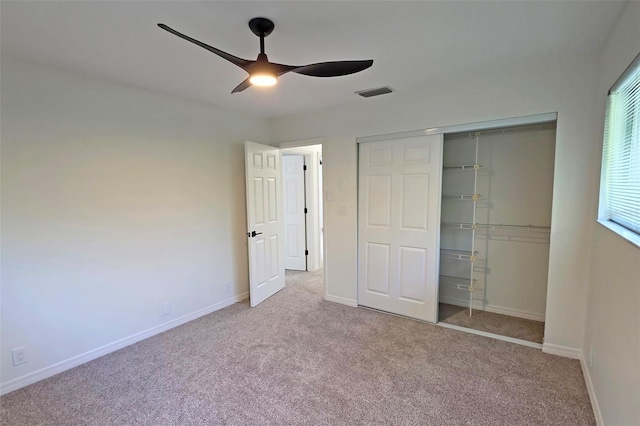 4074 Redbird Cir, Sarasota, FL 34231 - unfurnished bedroom featuring carpet floors, a closet, and a ceiling fan