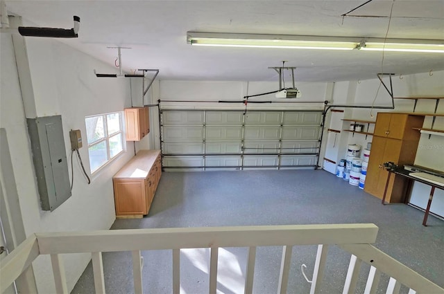 4074 Redbird Cir, Sarasota, FL 34231 - garage featuring electric panel and a garage door opener
