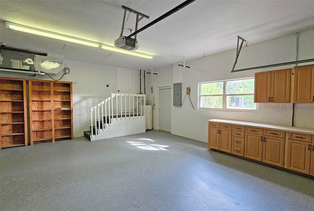 4074 Redbird Cir, Sarasota, FL 34231 - garage with a garage door opener and electric panel