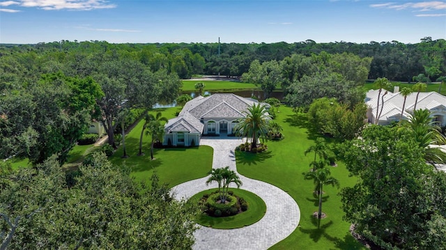 462 E Macewen Dr, Osprey, FL 34229 - aerial view of property and surrounding area featuring a nearby body of water and a heavily wooded area