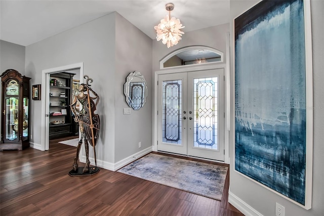 462 E Macewen Dr, Osprey, FL 34229 - foyer entrance featuring dark wood finished floors, french doors, and a chandelier