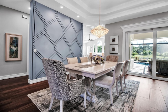 462 E Macewen Dr, Osprey, FL 34229 - dining area with a chandelier, dark wood-style floors, recessed lighting, ceiling fan, and a raised ceiling