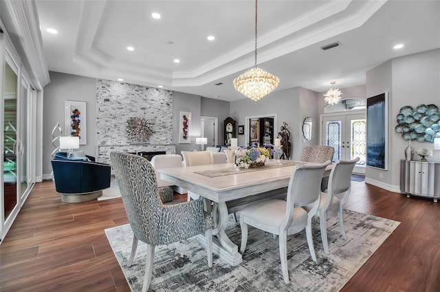 462 E Macewen Dr, Osprey, FL 34229 - dining area featuring a raised ceiling, french doors, dark wood-type flooring, a chandelier, and recessed lighting