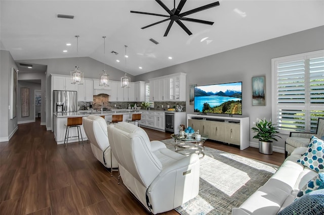 462 E Macewen Dr, Osprey, FL 34229 - living area with a ceiling fan, vaulted ceiling, wine cooler, dark wood-style floors, and plenty of natural light