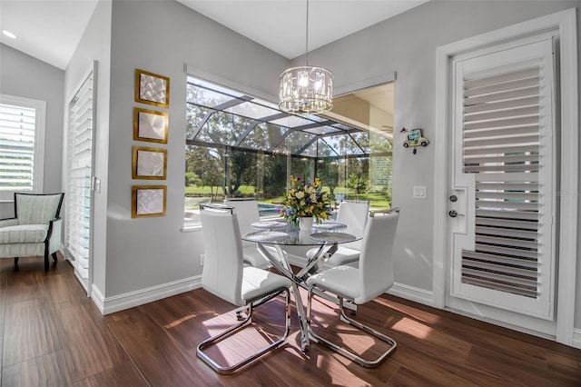 462 E Macewen Dr, Osprey, FL 34229 - dining space featuring wood finished floors, plenty of natural light, and a chandelier