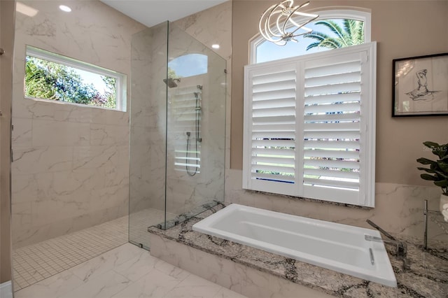 462 E Macewen Dr, Osprey, FL 34229 - bathroom featuring a garden tub, a marble finish shower, a chandelier, and marble finish floors