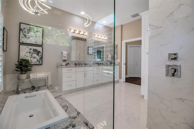 462 E Macewen Dr, Osprey, FL 34229 - bathroom featuring vanity, a garden tub, a chandelier, and marble finish flooring