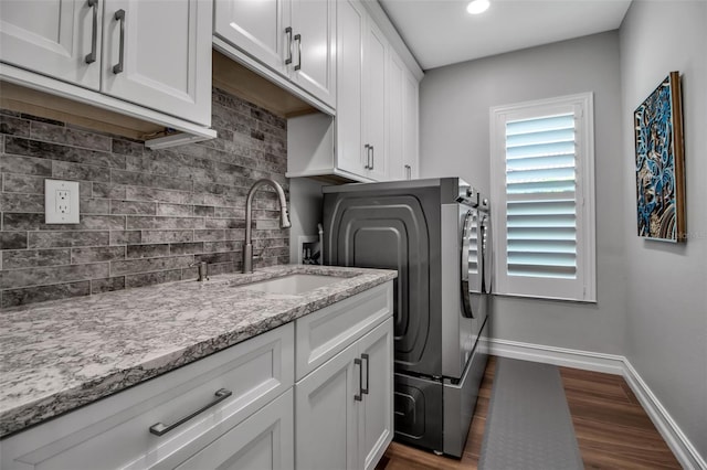 462 E Macewen Dr, Osprey, FL 34229 - laundry area with cabinet space, dark wood-type flooring, recessed lighting, and washer hookup