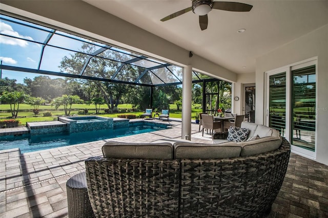 462 E Macewen Dr, Osprey, FL 34229 - view of swimming pool featuring a patio area, a pool with connected hot tub, ceiling fan, glass enclosure, and outdoor dining area