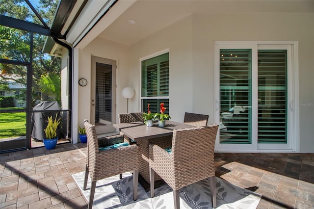 462 E Macewen Dr, Osprey, FL 34229 - view of patio / terrace featuring a lanai, area for grilling, and outdoor dining area
