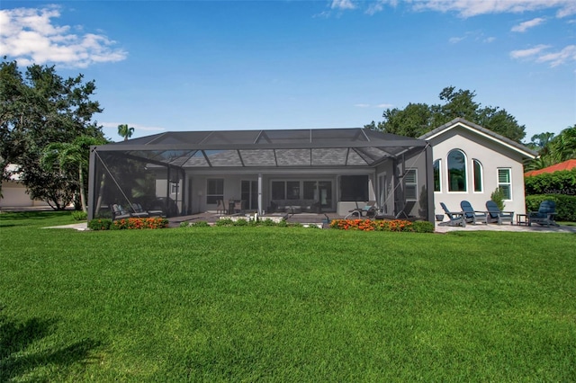 462 E Macewen Dr, Osprey, FL 34229 - rear view of property with a patio, a yard, glass enclosure, and stucco siding