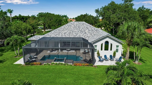 462 E Macewen Dr, Osprey, FL 34229 - back of property with a patio, an outdoor pool, a yard, a hot tub, and stucco siding