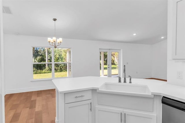 27471 Deep Creek Blvd, Punta Gorda, FL 33983 - kitchen featuring dishwasher, light countertops, white cabinets, and recessed lighting