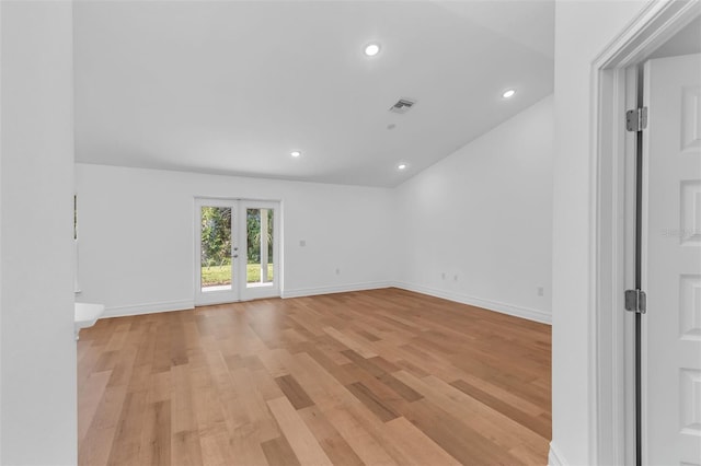 27471 Deep Creek Blvd, Punta Gorda, FL 33983 - spare room featuring light wood finished floors, recessed lighting, and lofted ceiling