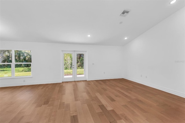 27471 Deep Creek Blvd, Punta Gorda, FL 33983 - spare room with light wood-type flooring, healthy amount of natural light, and recessed lighting