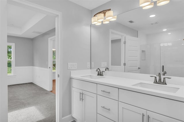 27471 Deep Creek Blvd, Punta Gorda, FL 33983 - full bathroom featuring wainscoting, double vanity, a shower stall, and recessed lighting