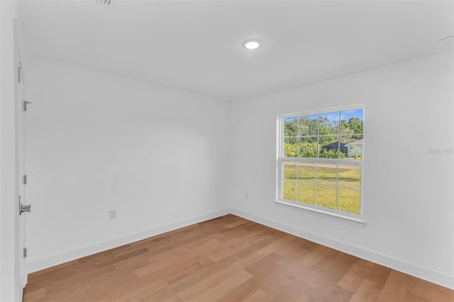 27471 Deep Creek Blvd, Punta Gorda, FL 33983 - empty room featuring light wood-style floors and recessed lighting