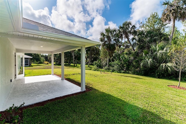 27471 Deep Creek Blvd, Punta Gorda, FL 33983 - view of grassy yard with a patio area