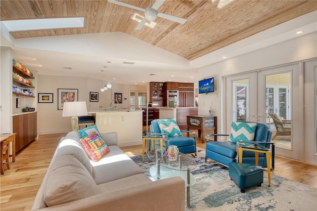 6308 4th Ave NW, Bradenton, FL 34209 - living area with a ceiling fan, lofted ceiling, light wood-type flooring, french doors, and wooden ceiling