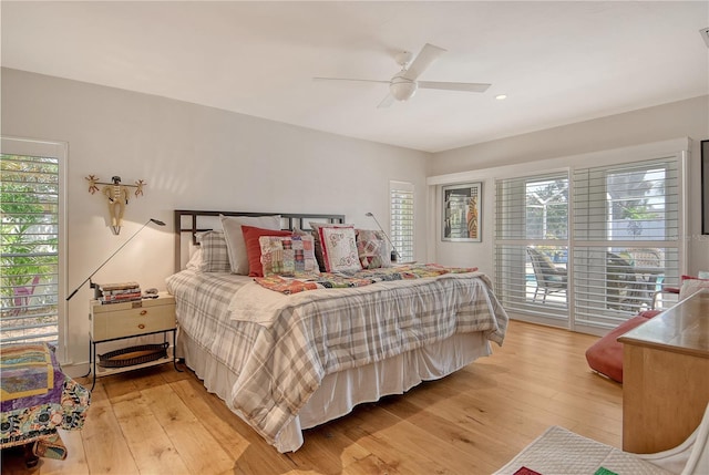 6308 4th Ave NW, Bradenton, FL 34209 - bedroom featuring multiple windows, light wood-type flooring, and a ceiling fan