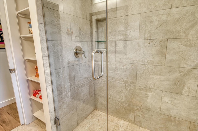 6308 4th Ave NW, Bradenton, FL 34209 - bathroom with a stall shower, a spacious closet, and built in shelves