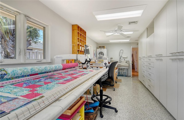 6308 4th Ave NW, Bradenton, FL 34209 - office area with dark speckled floor and stacked washer / drying machine