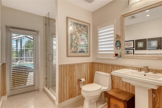 6308 4th Ave NW, Bradenton, FL 34209 - bathroom with wainscoting and a shower stall