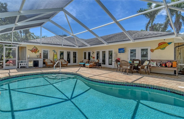 6308 4th Ave NW, Bradenton, FL 34209 - swimming pool featuring french doors, a patio area, and glass enclosure