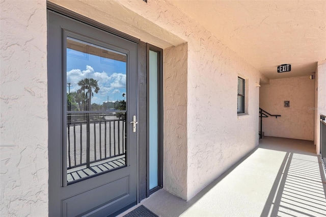6480 Midnight Pass Rd Unit 211, Sarasota, FL 34242 - doorway to property with stucco siding