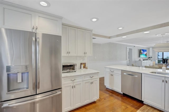 6480 Midnight Pass Rd Unit 211, Sarasota, FL 34242 - kitchen with appliances with stainless steel finishes, light wood-style flooring, white cabinetry, recessed lighting, and tasteful backsplash