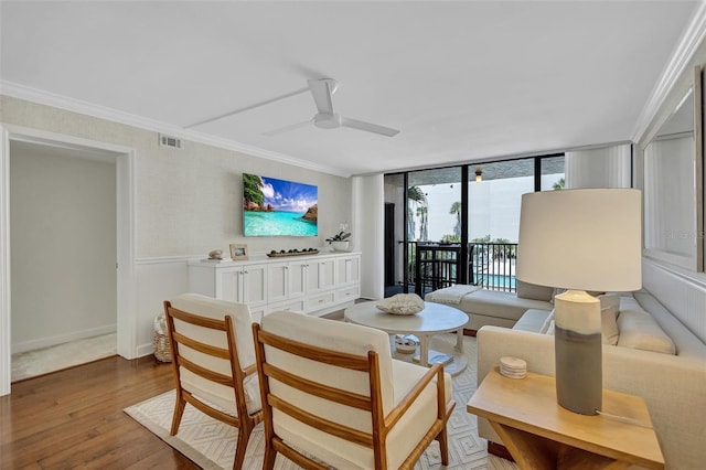 6480 Midnight Pass Rd Unit 211, Sarasota, FL 34242 - living area featuring wood finished floors, crown molding, a ceiling fan, and floor to ceiling windows