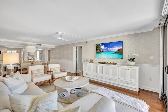 6480 Midnight Pass Rd Unit 211, Sarasota, FL 34242 - living area featuring wood finished floors, attic access, a wainscoted wall, wallpapered walls, and ornamental molding