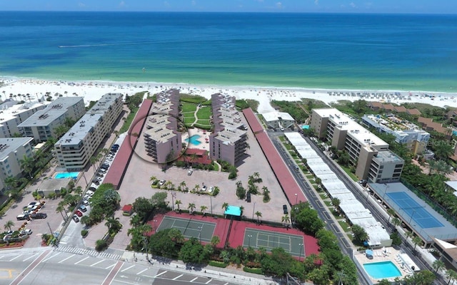 6480 Midnight Pass Rd Unit 211, Sarasota, FL 34242 - bird's eye view of waterfront with a beach and a pool area