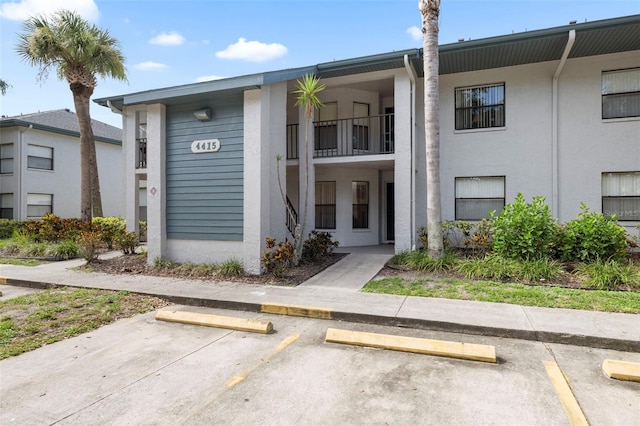 4415 45th Ave W Unit 102, Bradenton, FL 34210 - view of front of house with uncovered parking and stucco siding