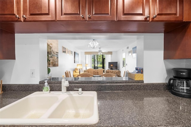4415 45th Ave W Unit 102, Bradenton, FL 34210 - kitchen view of a sink and dark countertops