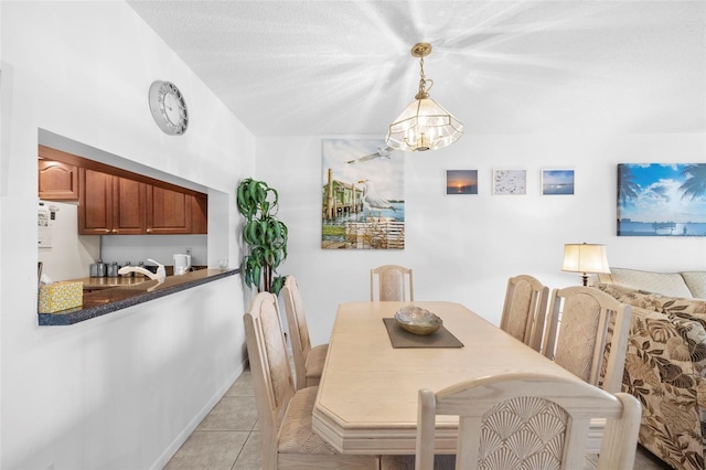 4415 45th Ave W Unit 102, Bradenton, FL 34210 - dining room featuring a chandelier and light tile patterned floors