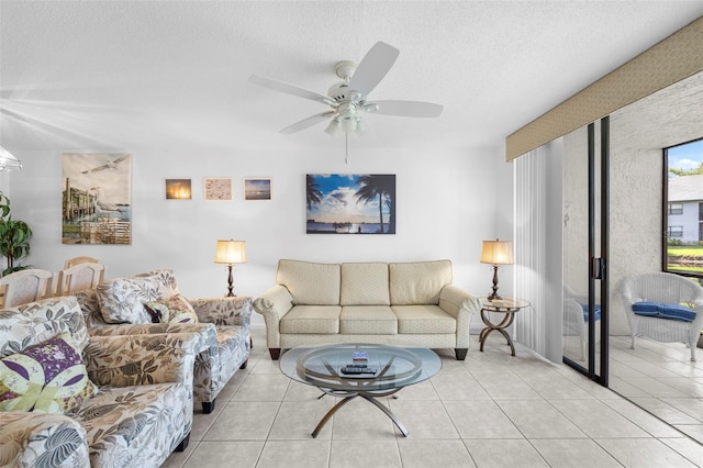 4415 45th Ave W Unit 102, Bradenton, FL 34210 - living area with a ceiling fan, light tile patterned floors, and a textured ceiling