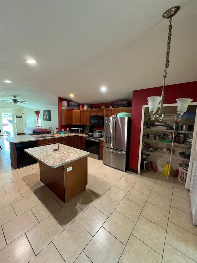 712 W Myrtle St, Lakeland, FL 33815 - kitchen with black appliances, a peninsula, ceiling fan, recessed lighting, and a kitchen island