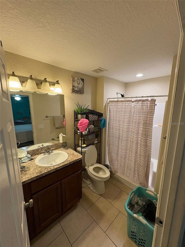 712 W Myrtle St, Lakeland, FL 33815 - full bath with vanity, shower / tub combo, tile patterned flooring, a textured ceiling, and a textured wall