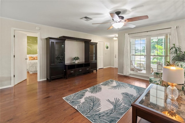 8606 Gold Pine Dr, Port Richey, FL 34668 - living area with a ceiling fan, wood finished floors, and crown molding