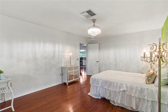 8606 Gold Pine Dr, Port Richey, FL 34668 - bedroom featuring a chandelier and wood finished floors