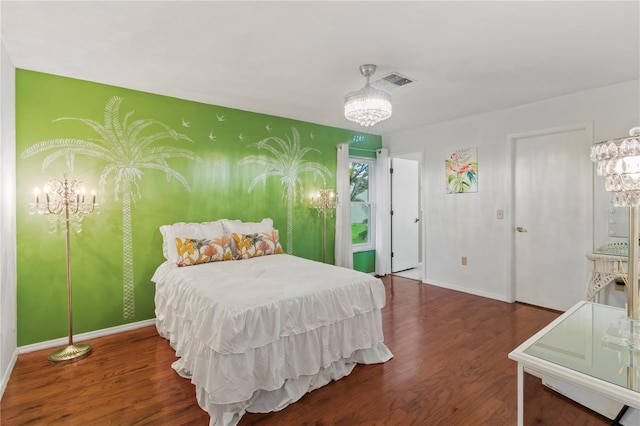 8606 Gold Pine Dr, Port Richey, FL 34668 - bedroom featuring a chandelier and wood finished floors
