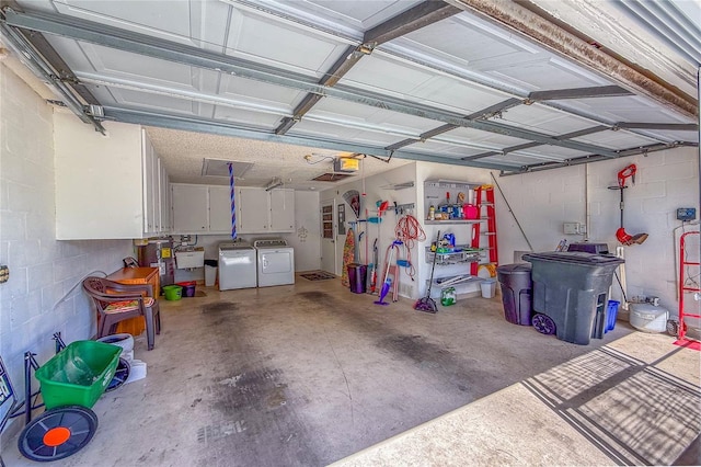 8606 Gold Pine Dr, Port Richey, FL 34668 - garage with washing machine and dryer, a garage door opener, and concrete block wall