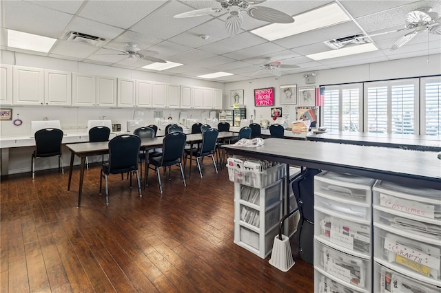 8606 Gold Pine Dr, Port Richey, FL 34668 - miscellaneous room featuring ceiling fan, a paneled ceiling, dark wood finished floors, and an office area