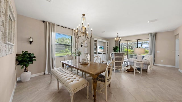 15992 Honey Suckle St, Port Charlotte, FL 33953 - dining area featuring a chandelier, healthy amount of natural light, and light tile patterned flooring