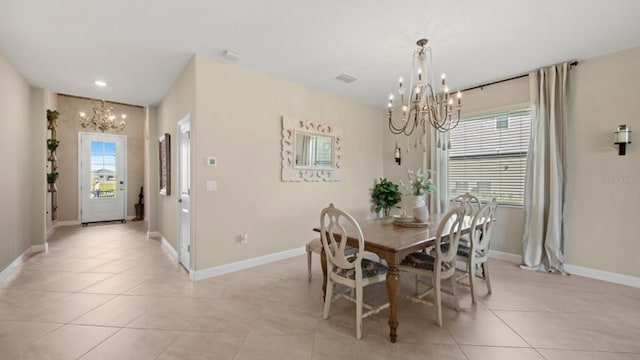 15992 Honey Suckle St, Port Charlotte, FL 33953 - dining space featuring a chandelier and light tile patterned floors