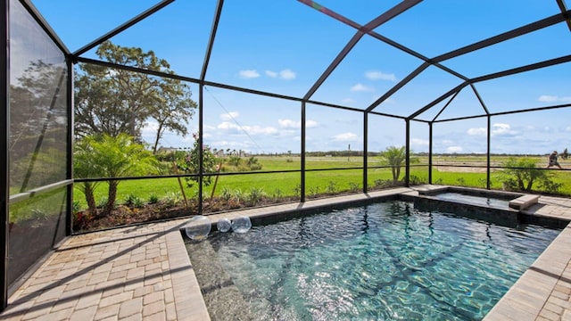 15992 Honey Suckle St, Port Charlotte, FL 33953 - view of pool featuring a pool, a patio area, glass enclosure, and a view of countryside