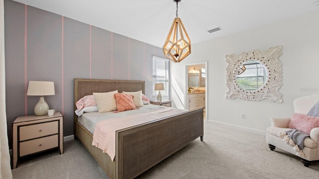 15992 Honey Suckle St, Port Charlotte, FL 33953 - bedroom featuring light carpet, ensuite bath, and a chandelier