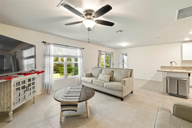 24748 Rio Villa Lakes Cir, Punta Gorda, FL 33950 - living area featuring light tile patterned flooring and a ceiling fan